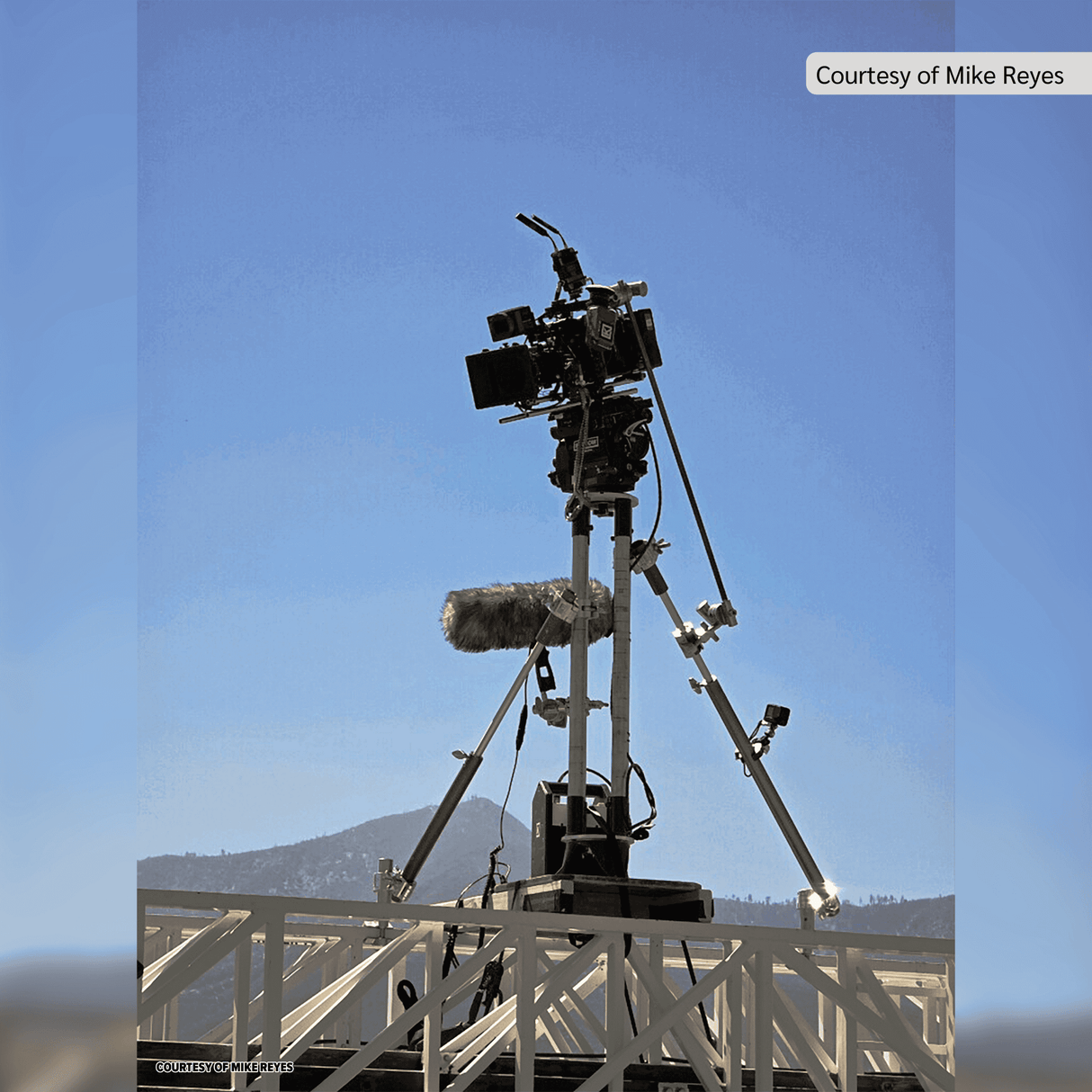 Camera rig setup with boom mic on a sunny day, showcasing equipment for filming in an outdoor location.