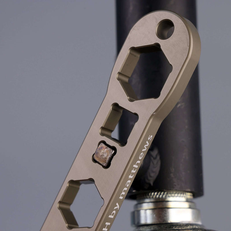 Matthews Patriot Wrench showcasing various cutouts, designed for rigging professionals with a lanyard hole for safety.