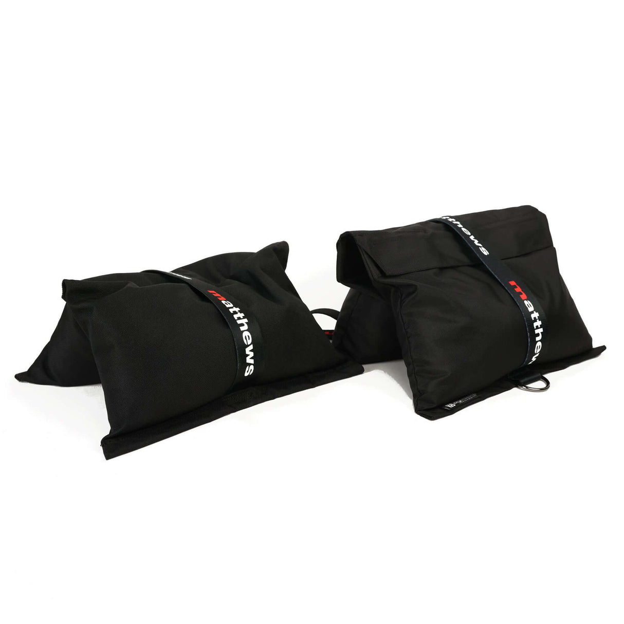 Portable black sandbags for weight support and stabilization on set, made from durable Cordura.