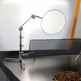 Compact C-Stand with reflector for product photography, showcasing adjustable design and professional-grade support.