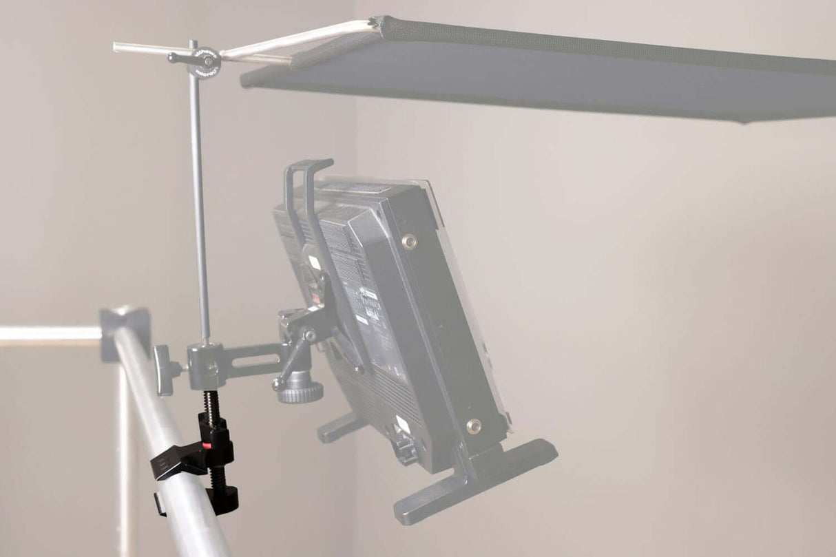 Black Hyper-Chrome™ Matthellini2 Clamp securely holding a light fixture on a support stand in a studio setup.